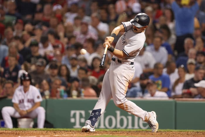 Jul 8, 2022; Boston, Massachusetts, USA; New York Yankees left fielder Matt Carpenter (24) hits a home run against the Boston Red Sox during the fourth inning at Fenway Park. Mandatory Credit: Paul Rutherford-USA TODAY Sports